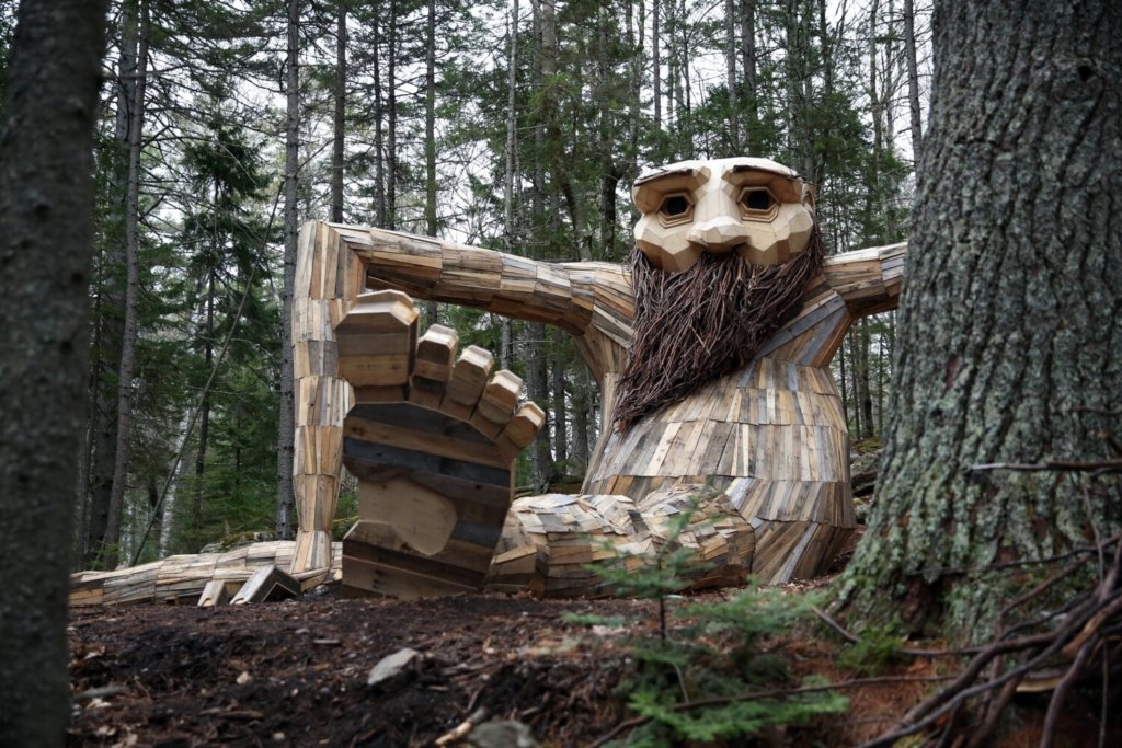 A giant wooden troll lurking in the woods at Coastal Maine Botanical Gardens